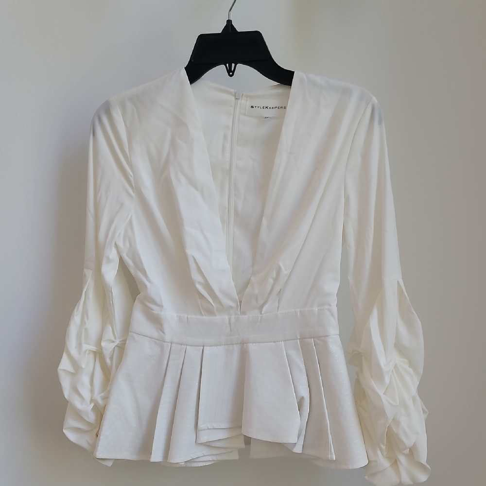 Cream Peplum Blouse with Ruffled 3/4 Sleeves and Notched Collar